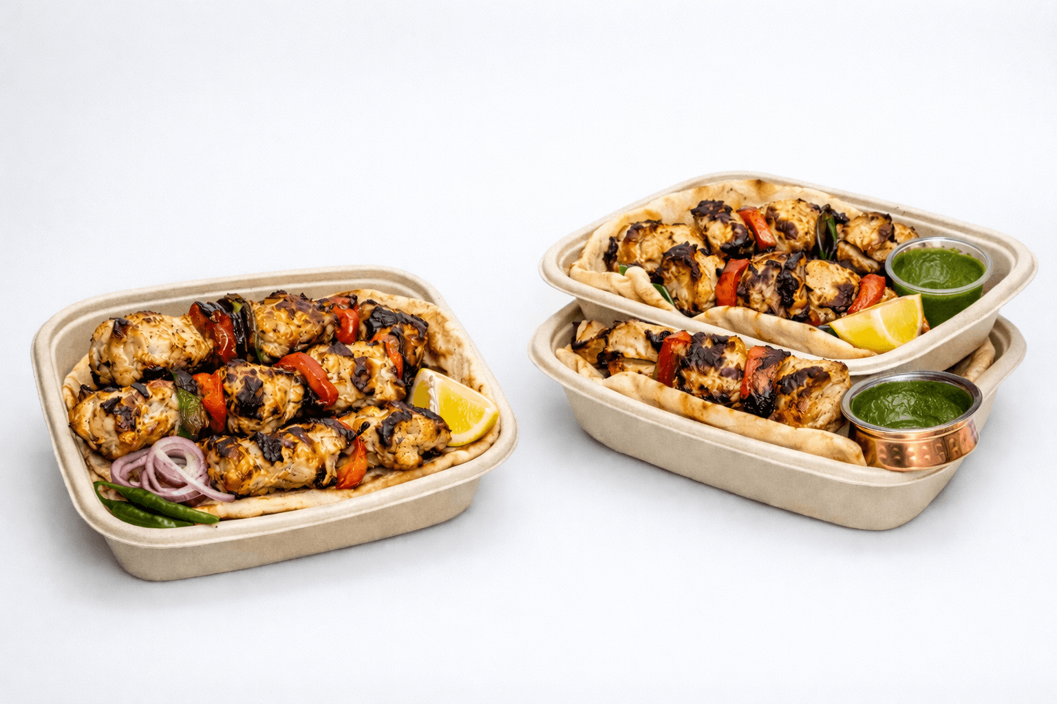 SKEWERBROS chicken kebab meal containers with pita and chutney